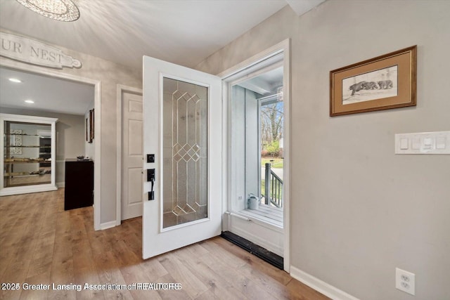 doorway to outside with light hardwood / wood-style flooring