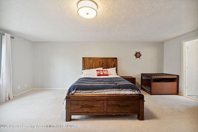 carpeted bedroom with a textured ceiling