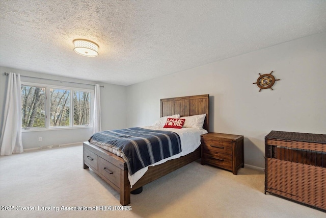 carpeted bedroom with a textured ceiling