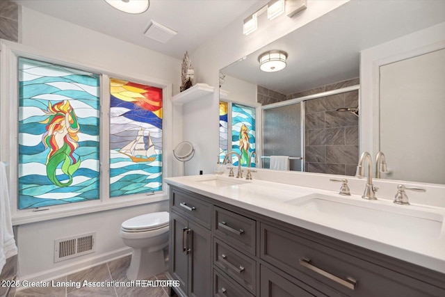 bathroom featuring walk in shower, vanity, and toilet