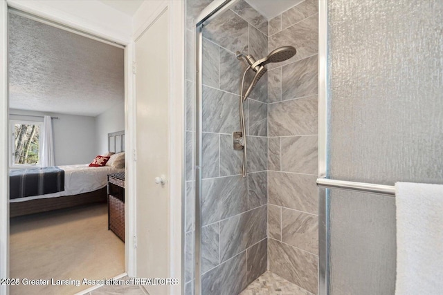 bathroom with walk in shower and a textured ceiling