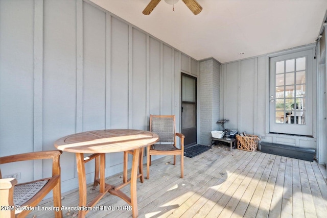 wooden deck featuring ceiling fan