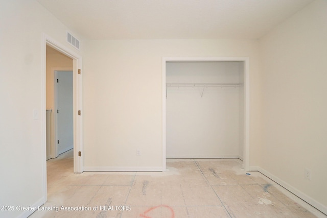 unfurnished bedroom with a closet