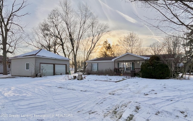 single story home with a porch and a garage