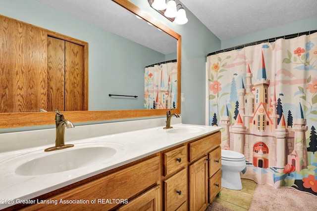 bathroom featuring curtained shower, tile patterned flooring, vanity, toilet, and a textured ceiling