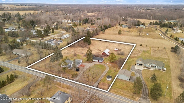 birds eye view of property featuring a rural view