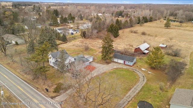 drone / aerial view with a rural view and a wooded view