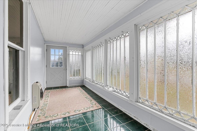 unfurnished sunroom with wooden ceiling