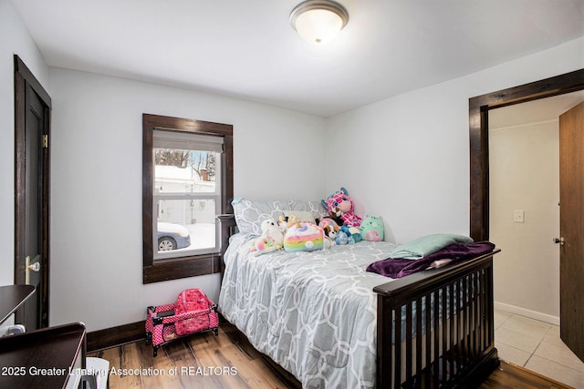 bedroom with hardwood / wood-style flooring