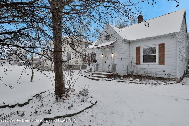 view of snow covered property