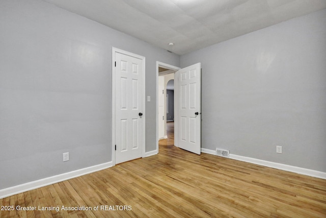 empty room with light wood-type flooring