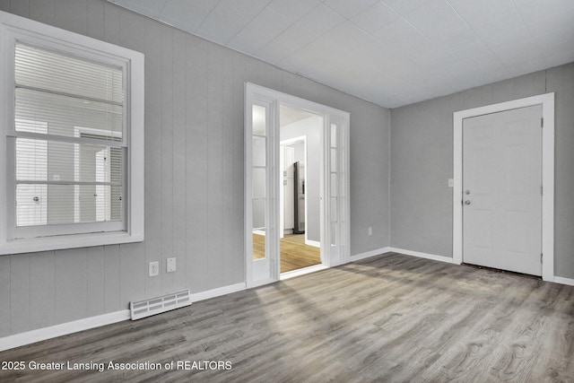 spare room featuring light wood-type flooring