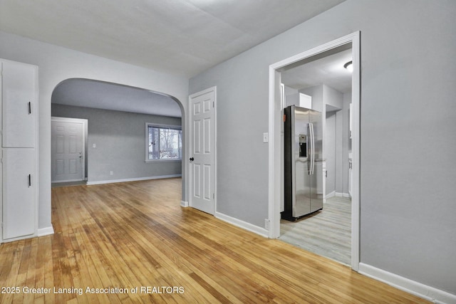 unfurnished room featuring light hardwood / wood-style floors