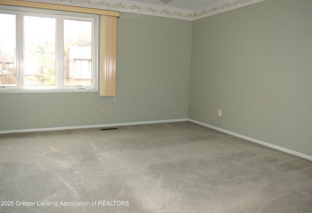 empty room featuring carpet floors