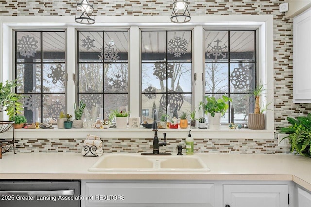 bathroom with tasteful backsplash and sink