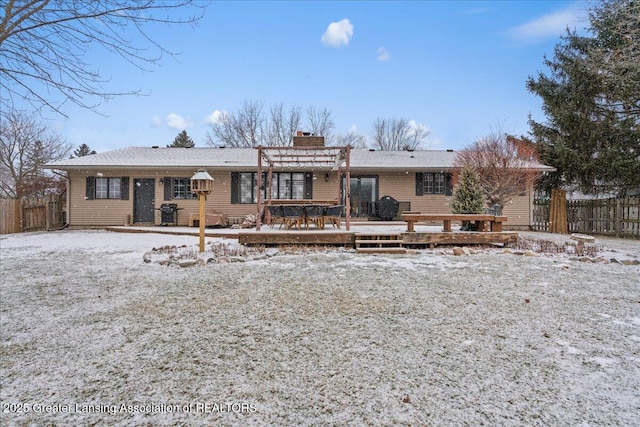 snow covered property with a wooden deck