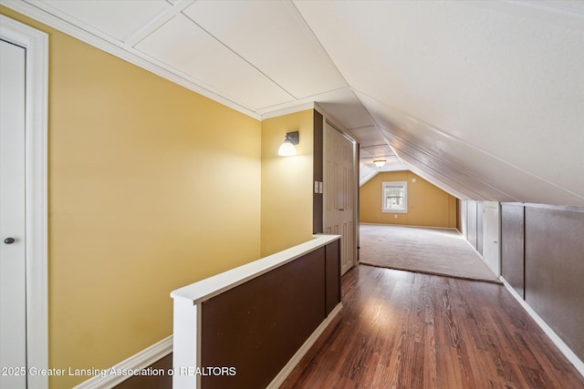 additional living space featuring lofted ceiling and wood-type flooring