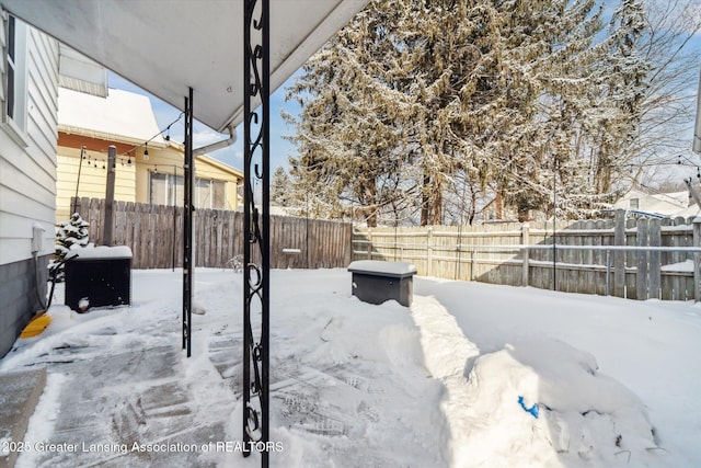 view of yard covered in snow