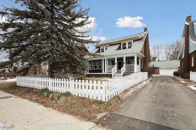 view of front of home with a porch and a garage