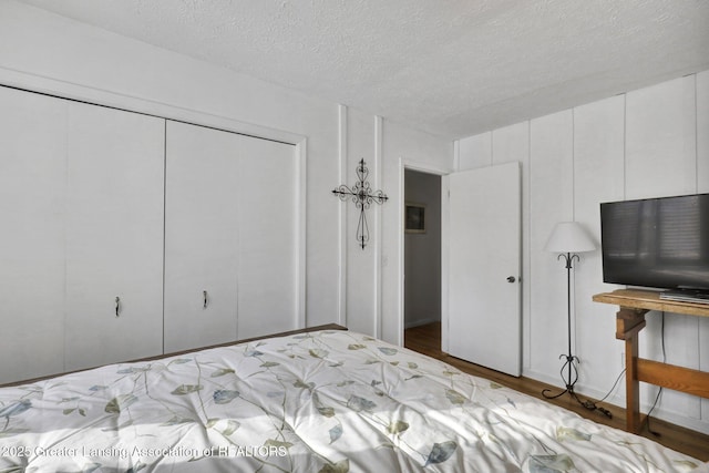 unfurnished bedroom featuring a closet and a textured ceiling