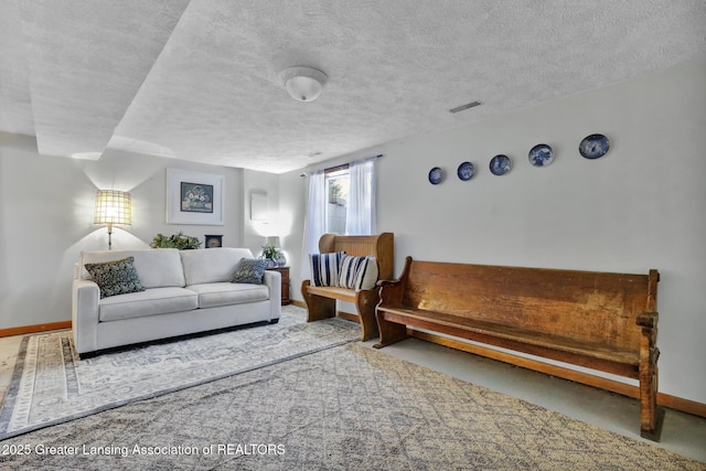 carpeted living room with a textured ceiling