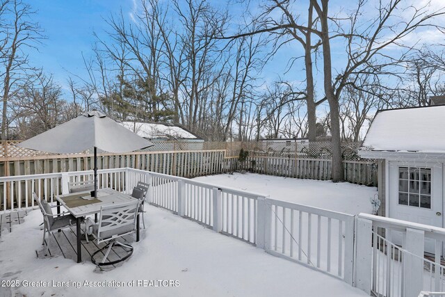 view of snow covered deck