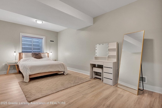 bedroom featuring light wood-type flooring