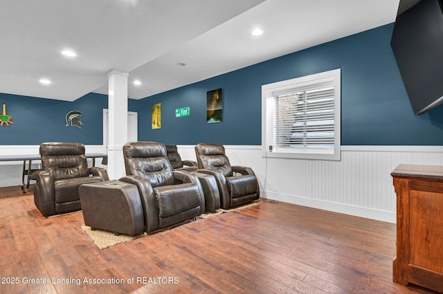 cinema featuring hardwood / wood-style flooring