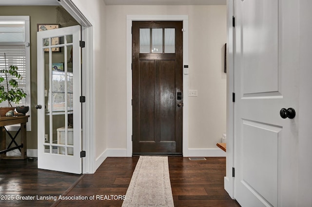 foyer entrance with dark hardwood / wood-style flooring