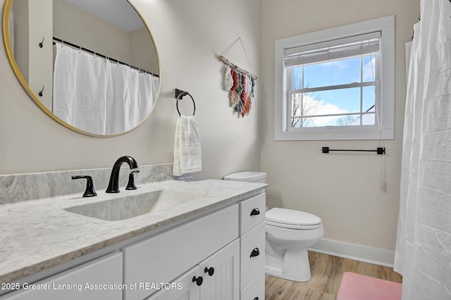 bathroom with vanity, hardwood / wood-style floors, and toilet