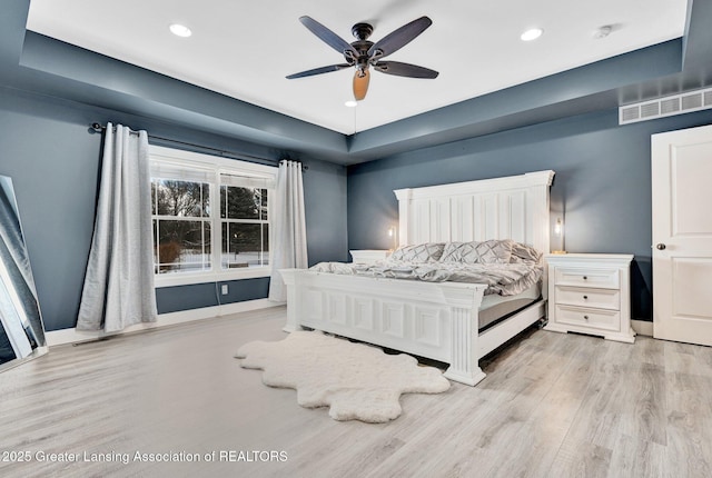 bedroom featuring light hardwood / wood-style flooring and ceiling fan