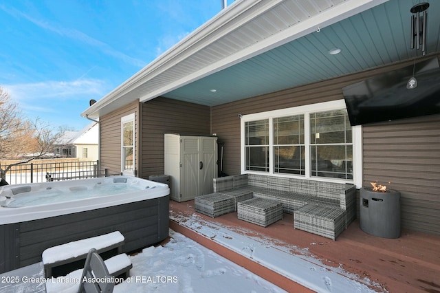 exterior space with a hot tub and outdoor lounge area