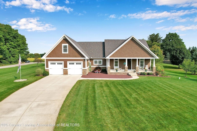 craftsman-style home featuring a porch, a garage, and a front yard