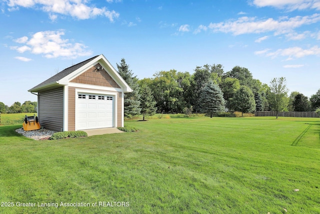 view of yard featuring an outbuilding and a garage