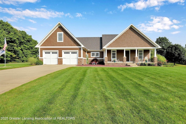 1227 Joann Ln, Williamston, MI 48895 - craftsman-style house with concrete driveway, a front yard, a porch, and stone siding