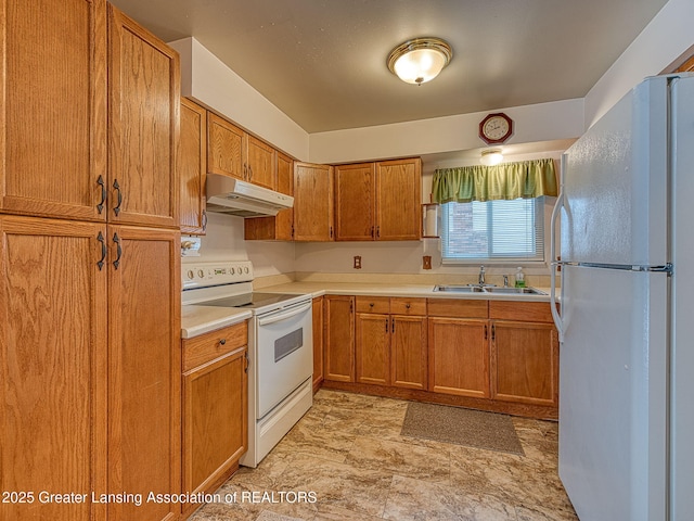 kitchen featuring sink and white appliances