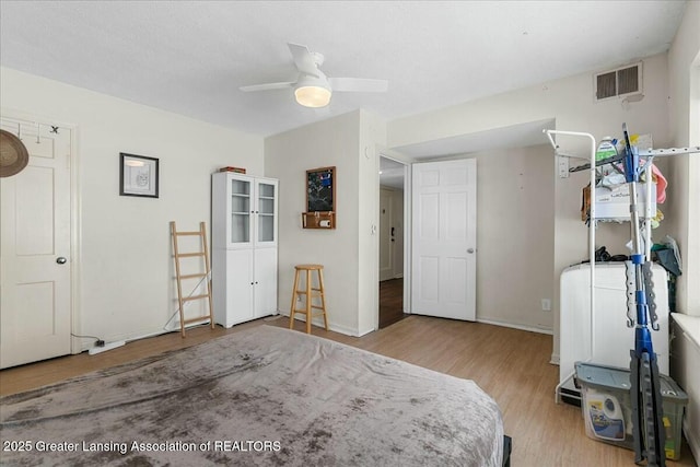 bedroom featuring ceiling fan and light wood-type flooring