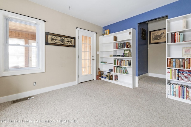 spare room with light colored carpet