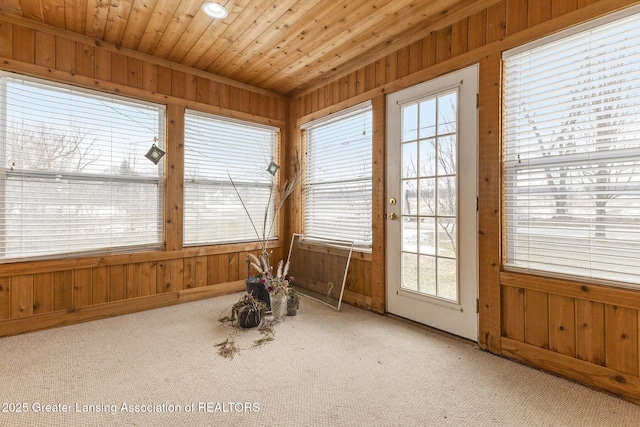 unfurnished sunroom featuring wooden ceiling