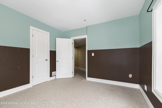 unfurnished bedroom with carpet flooring