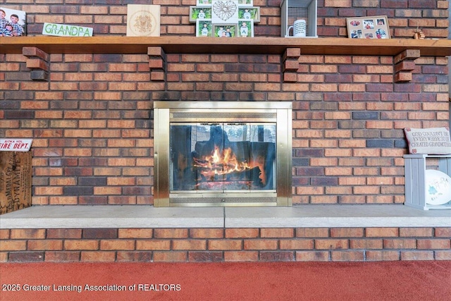 details featuring a brick fireplace