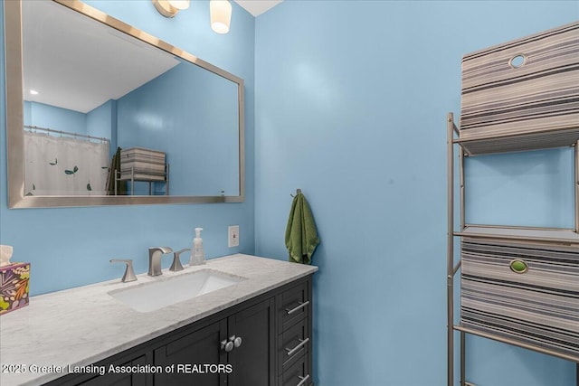 bathroom with vanity and curtained shower