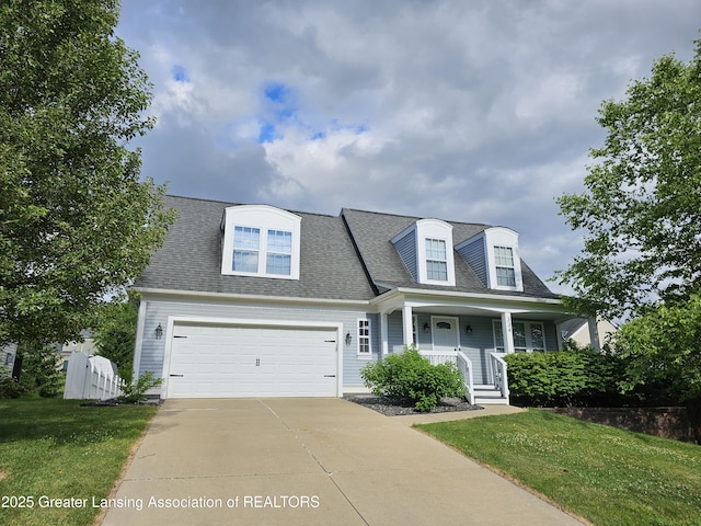 cape cod-style house with a garage, a porch, and a front yard