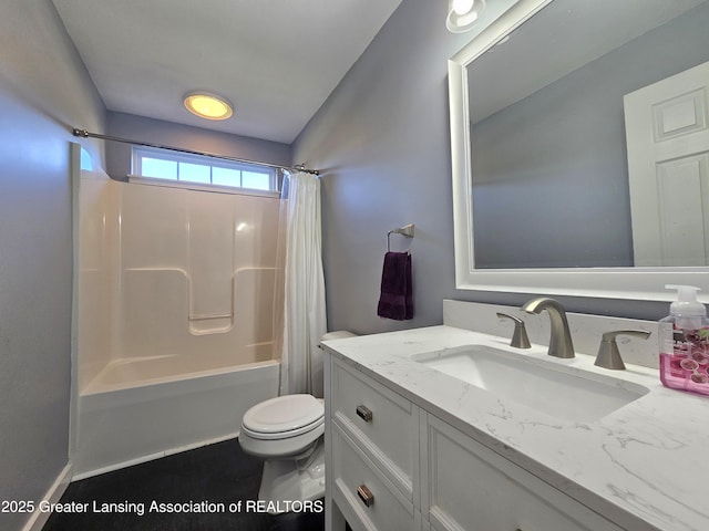 full bathroom with vanity, shower / tub combo, and toilet