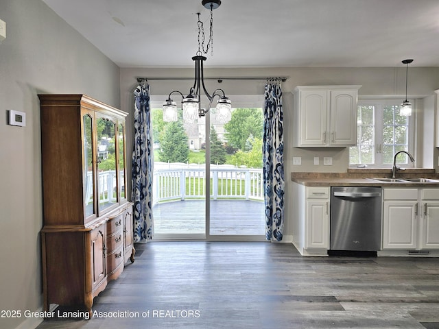 kitchen with sink, hanging light fixtures, dark hardwood / wood-style flooring, dishwasher, and white cabinets