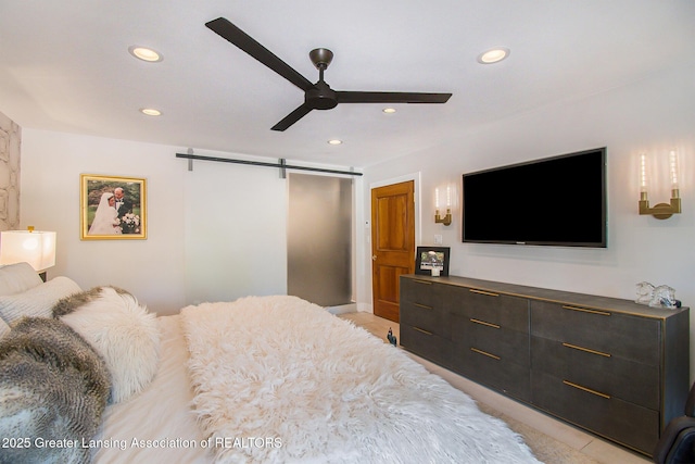8955 W Braden Rd, Haslett, MI 48840 - bedroom featuring a barn door and ceiling fan