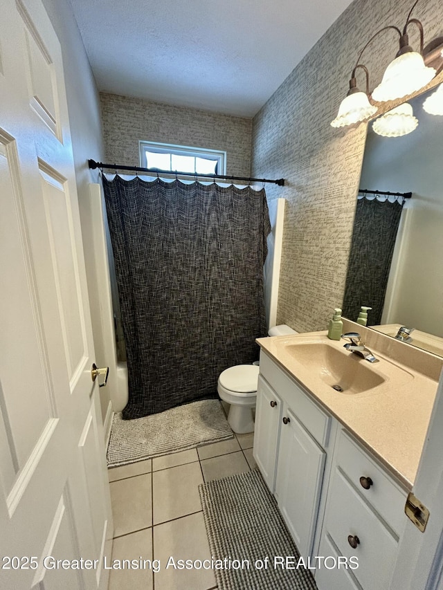 bathroom with vanity, curtained shower, tile patterned floors, and toilet