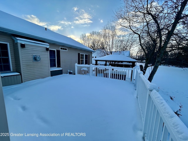 snow covered deck featuring a gazebo