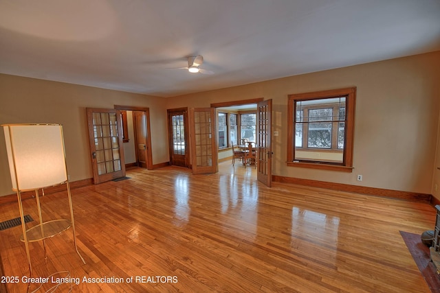 unfurnished room featuring ceiling fan and light hardwood / wood-style floors