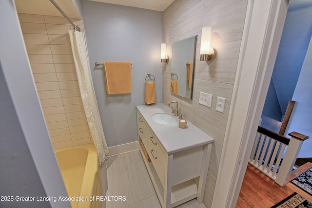 bathroom featuring vanity and shower / tub combo